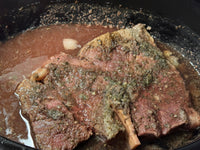 cooked roast in crockpot with seasonings